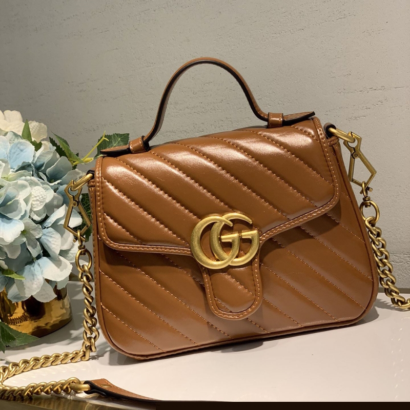 G*u*i top handle bags